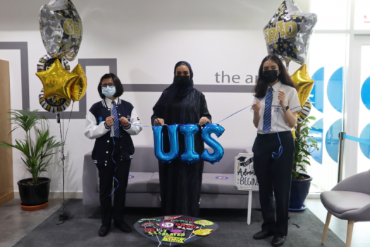 L to R Top IB Performers at UIS Durga Chandrashekhar (L) and Tala Dahe (R) being congratulated by Head Girl Shaikha Alnaqbi (Middle)*